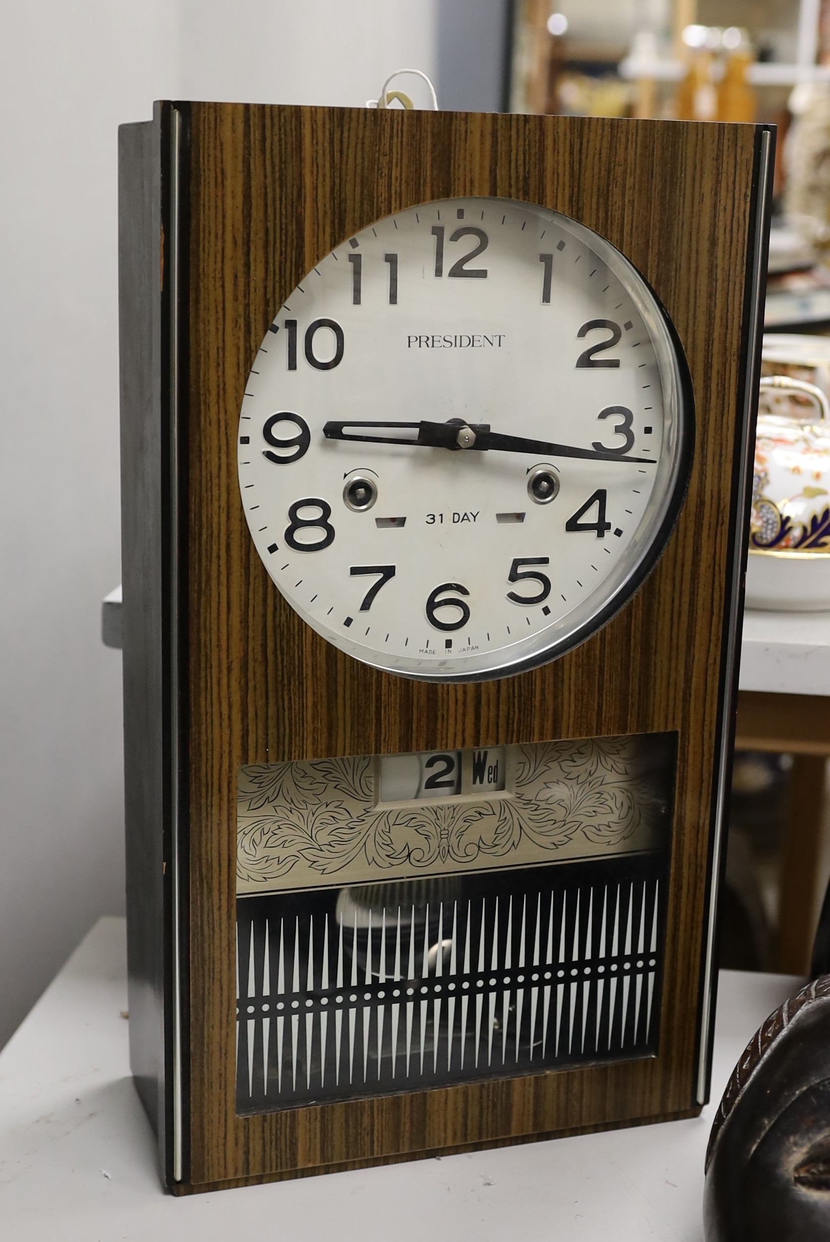 A 1970's President wall clock, 42 cms high.